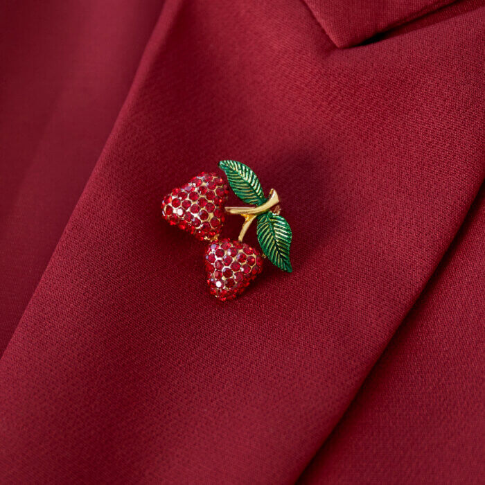 Broche kersjes met glitters